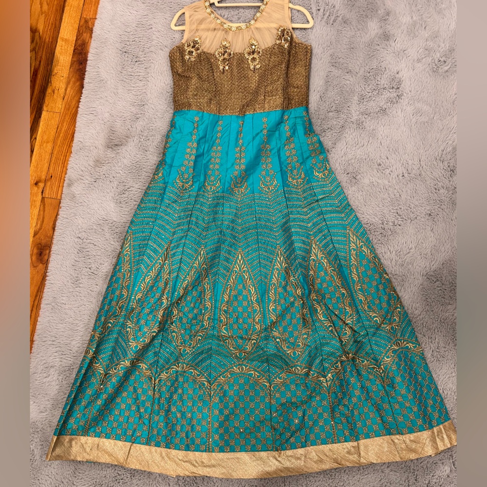 Teal and gold anarkali. Teal churidaar (tights) and gold dupatta.